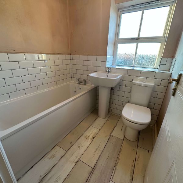Updating a traditional family suite bathroom